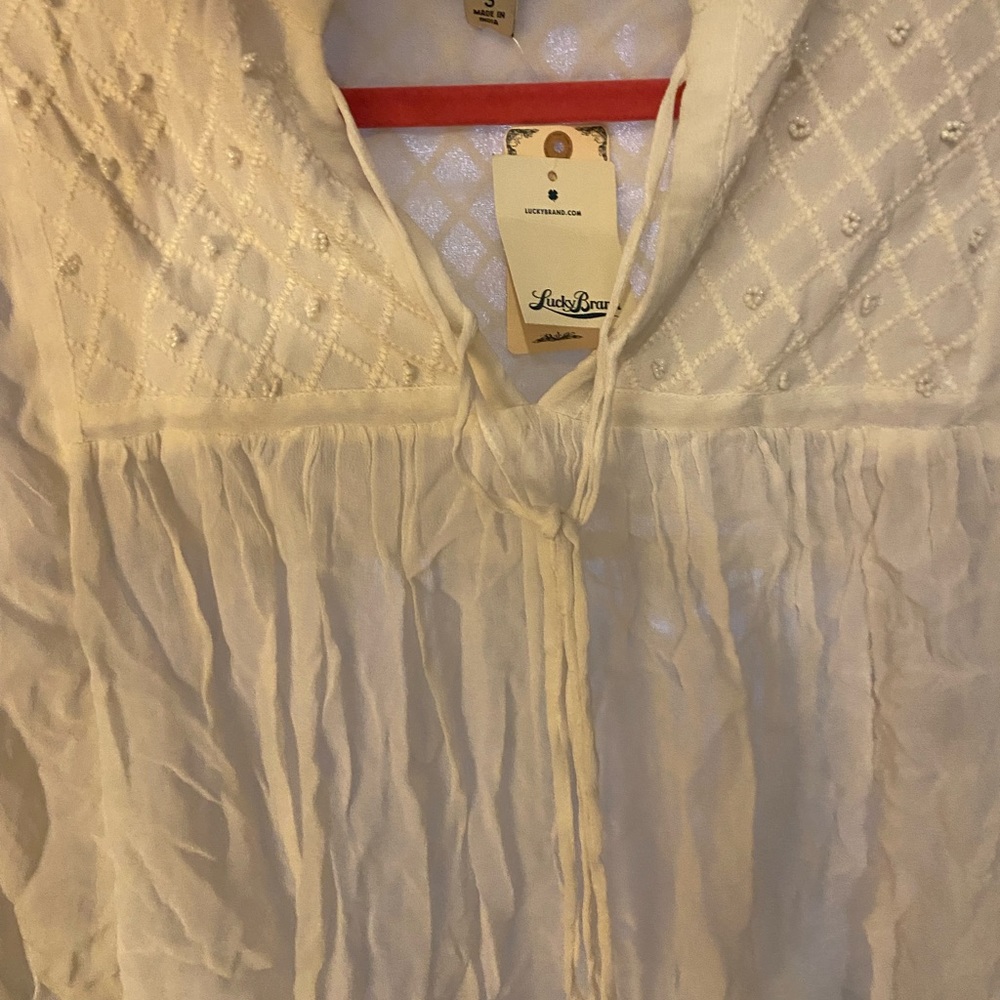 White lucky blouse never worn with tags, size small